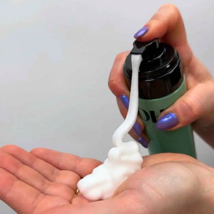 Hands of a woman spraying a bit of LOHY Chutzpah Volumising Foam in her hand